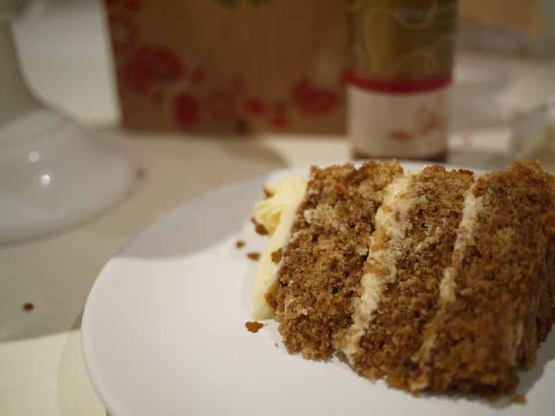 slice of gingerbread latte layer cake topped with gingerbread buttercream.