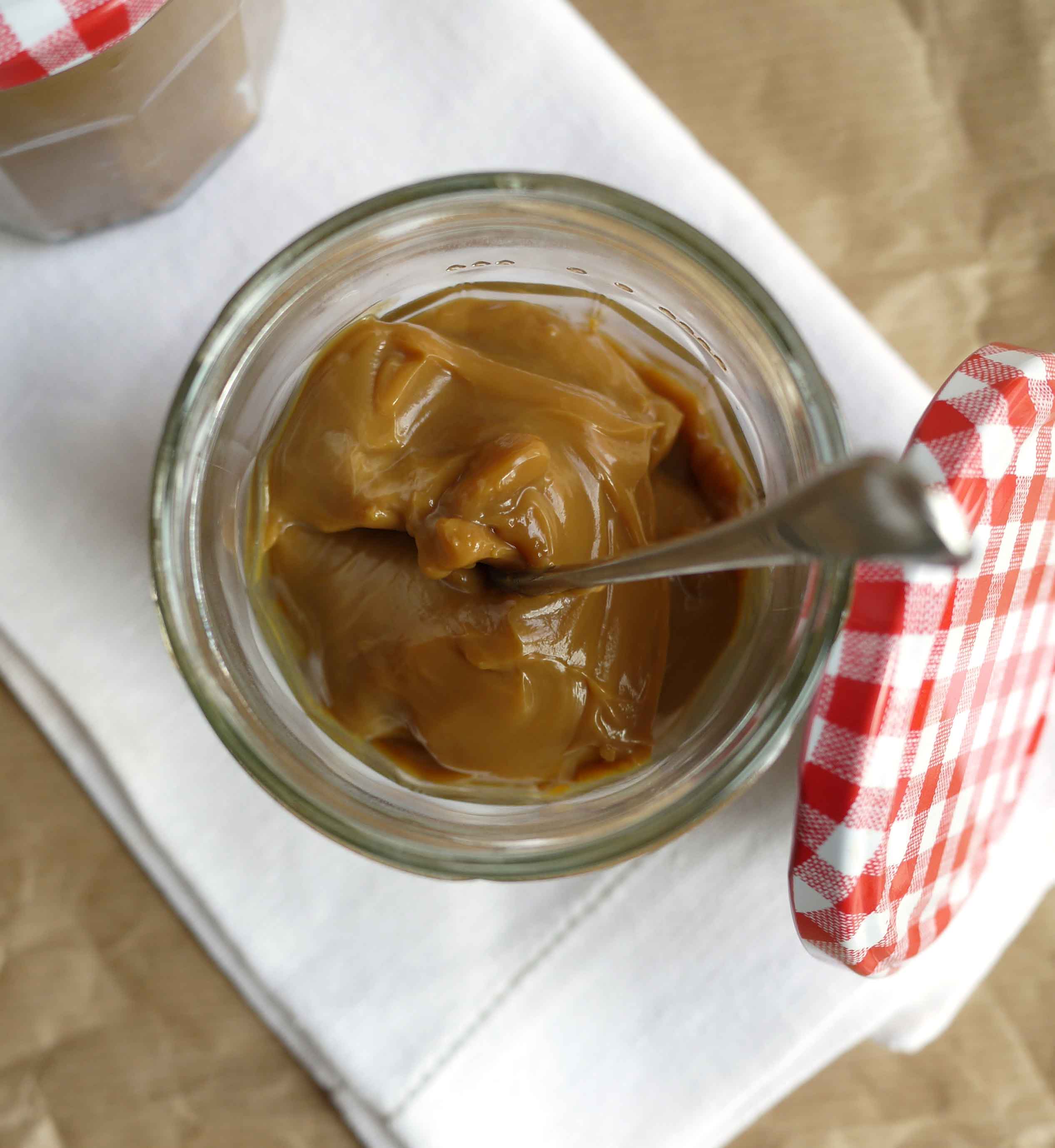 The easiest ever slow cooker (crockpot) home made condensed milk caramel sauce, made without cream or fuss. Perfectly smooth, not grainy, slow cooker caramel!