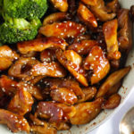 Frying pan with Teriyaki Chicken and sticky sauce and broccoli in