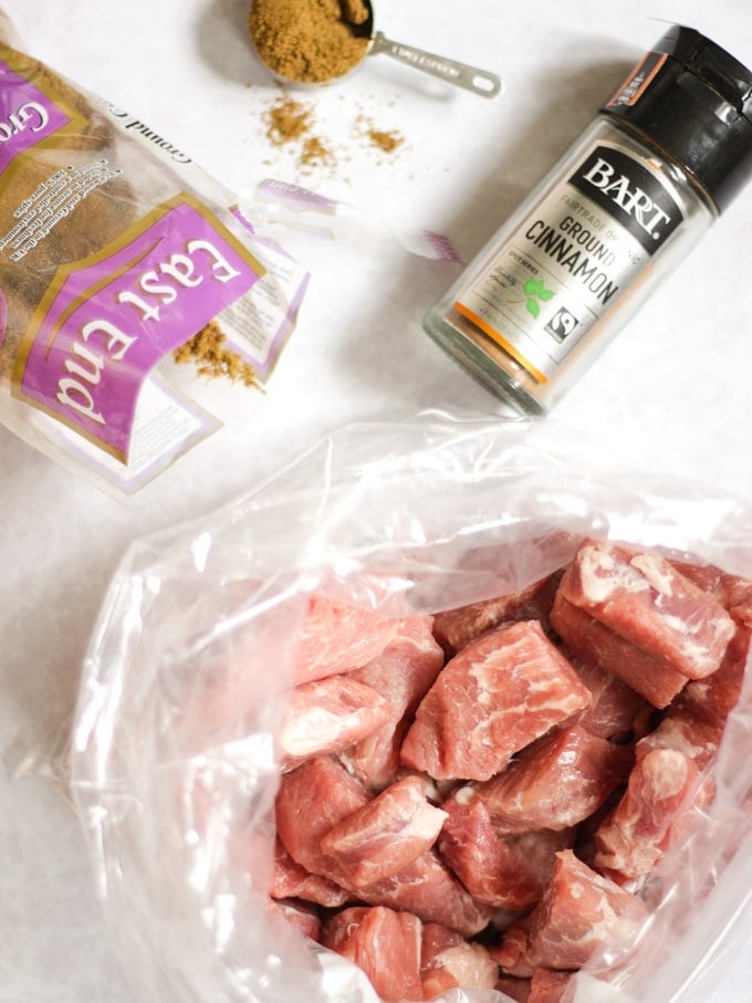 Raw meat in a bag ready to be coated with cinnamon and cumin