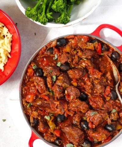Pork casserole in tomato sauce with orzo pasta and tender stem broccoli