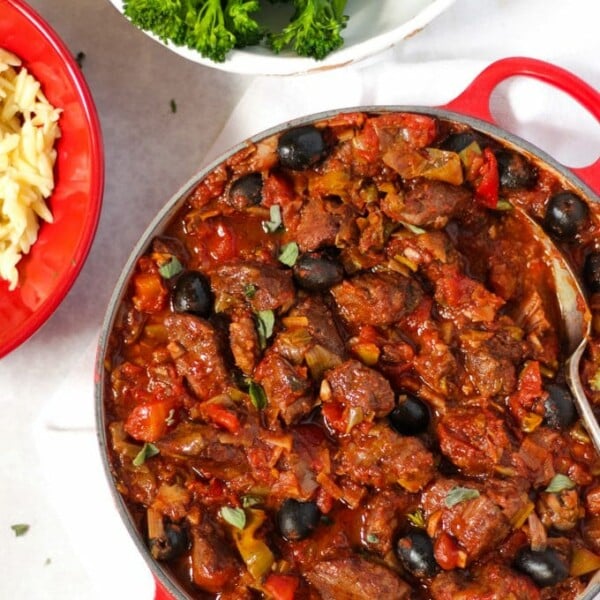 Pork casserole in tomato sauce with orzo pasta and tender stem broccoli