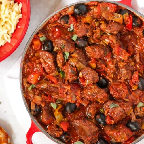 Pork casserole in tomato sauce with orzo pasta and tender stem broccoli