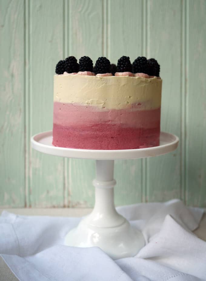 Blackberry and Elderflower Pimms Layer Cake on Milk Glass Cake Stand