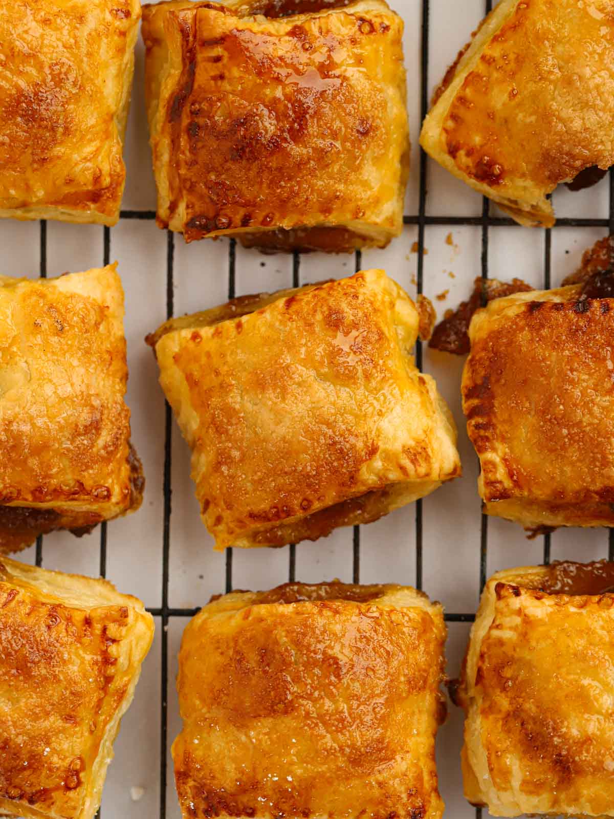 Puff Pastry Mince pies for Christmas cooling on a wire rack.