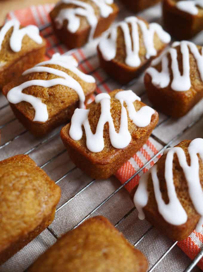 Mini Pumpkin Bread Loaves with icing sugar on top.
