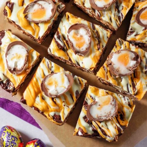 Creme Egg Rocky Road pieces cut up on a board.