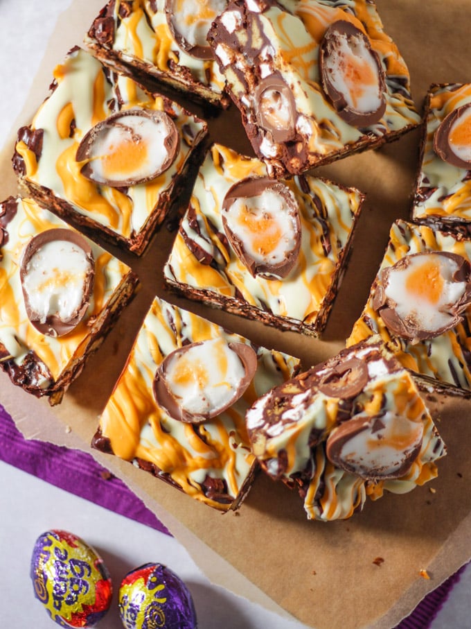 Creme Egg Rocky Road pieces cut up on a board.