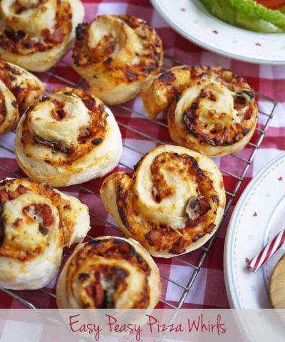 Easy Peasy Pizza Whirls - A great teatime recipe for children and families. These also make a super lunchbox filler or picnic treat. Get the kids cooking, helping to make them too, they're great fun! https://www.tamingtwins.com