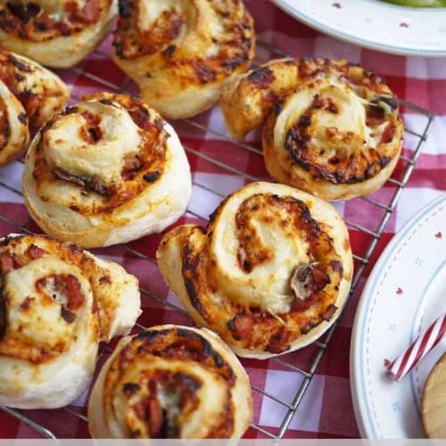 Easy Peasy Pizza Rolls. A great teatime recipe for children and families. These also make a super lunchbox filler or picnic treat. Get the kids cooking, helping to make them too, they're great fun!