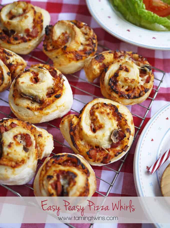 Easy Peasy Pizza Whirls - A great teatime recipe for children and families. These also make a super lunchbox filler or picnic treat. Get the kids cooking, helping to make them too, they're great fun! https://www.tamingtwins.com