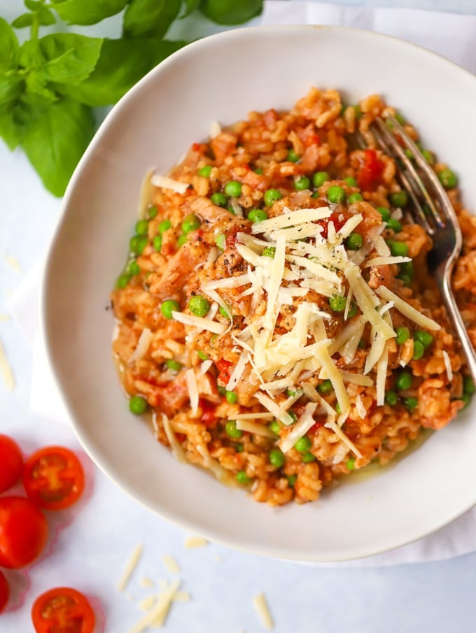 Bowl of oven baked risotto topped with cheese