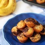 Mini banana muffins, made with a secret ingredient! Made with no need for oil or eggs, delicious, light, packed with chocolate chips, these little cakes make a super afternoon snack or breakfast treat. https://www.tamingtwins.com
