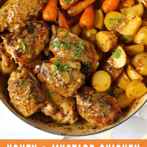 Honey and mustard chicken in a le creuset dish with carrots and potatoes