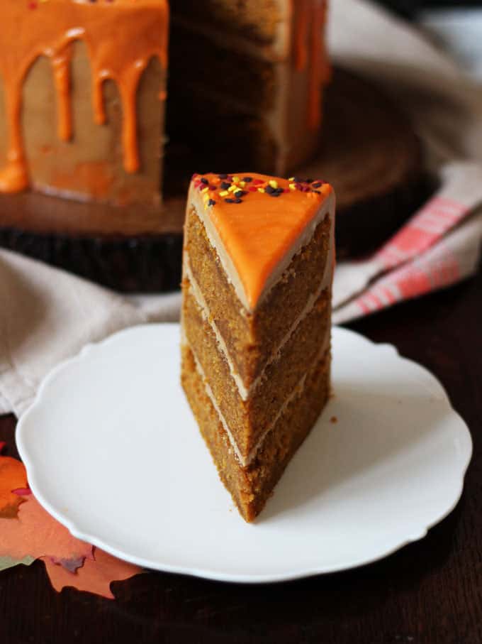 THE Pumpkin Spice Latte Cake Recipe - layers of soft pumpkin spiced cake, with fluffy latte coffee buttercream frosting and a white chocolate ganache icing drizzle. Here's how to make a Pumpkin Spice Latte Layer Cake!