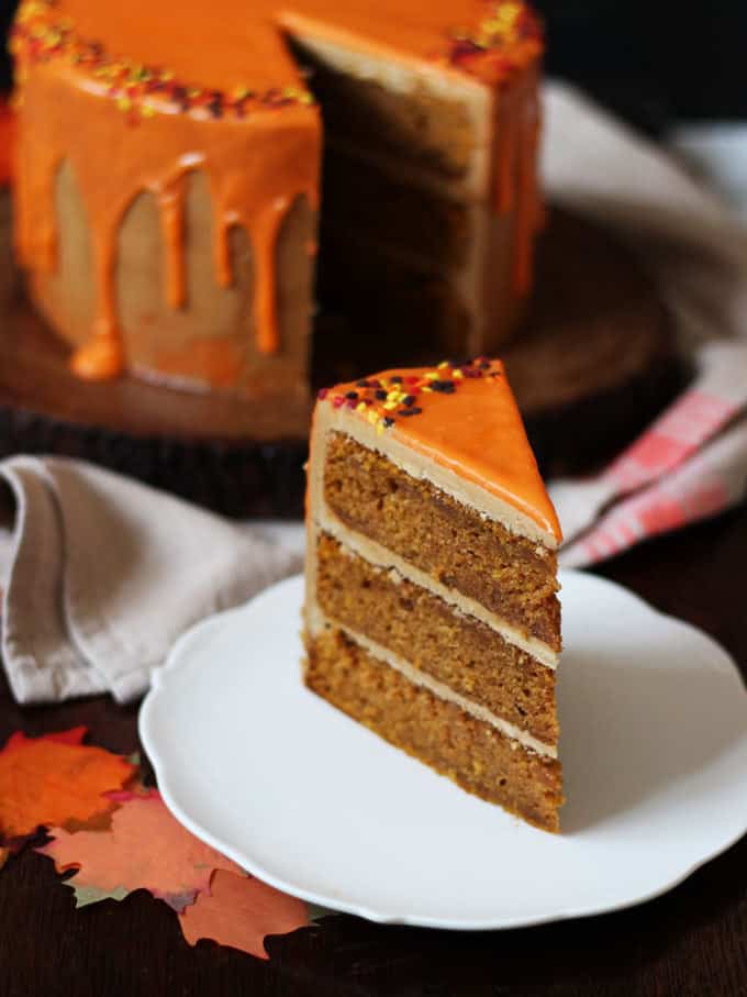 THE Pumpkin Spice Latte Cake Recipe - layers of soft pumpkin spiced cake, with fluffy latte coffee buttercream frosting and a white chocolate ganache icing drizzle. Here's how to make a Pumpkin Spice Latte Layer Cake!