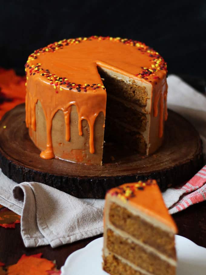 THE Pumpkin Spice Latte Cake Recipe - layers of soft pumpkin spiced cake, with fluffy latte coffee buttercream frosting and a white chocolate ganache icing drizzle. Here's how to make a Pumpkin Spice Latte Layer Cake!