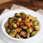 Oven baked Brussels sprouts with bacon, butternut squash and Parmesan cheese. The best ever Brussels sprouts, oven roasted for the perfect Christmas side dish.