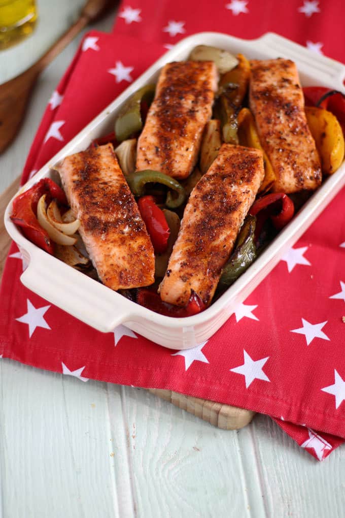 This one tray oven baked Cajun salmon, is an easy, one pan dinner, perfect for a tasty midweek meal. Complete with spiced potato wedges and vegetables.