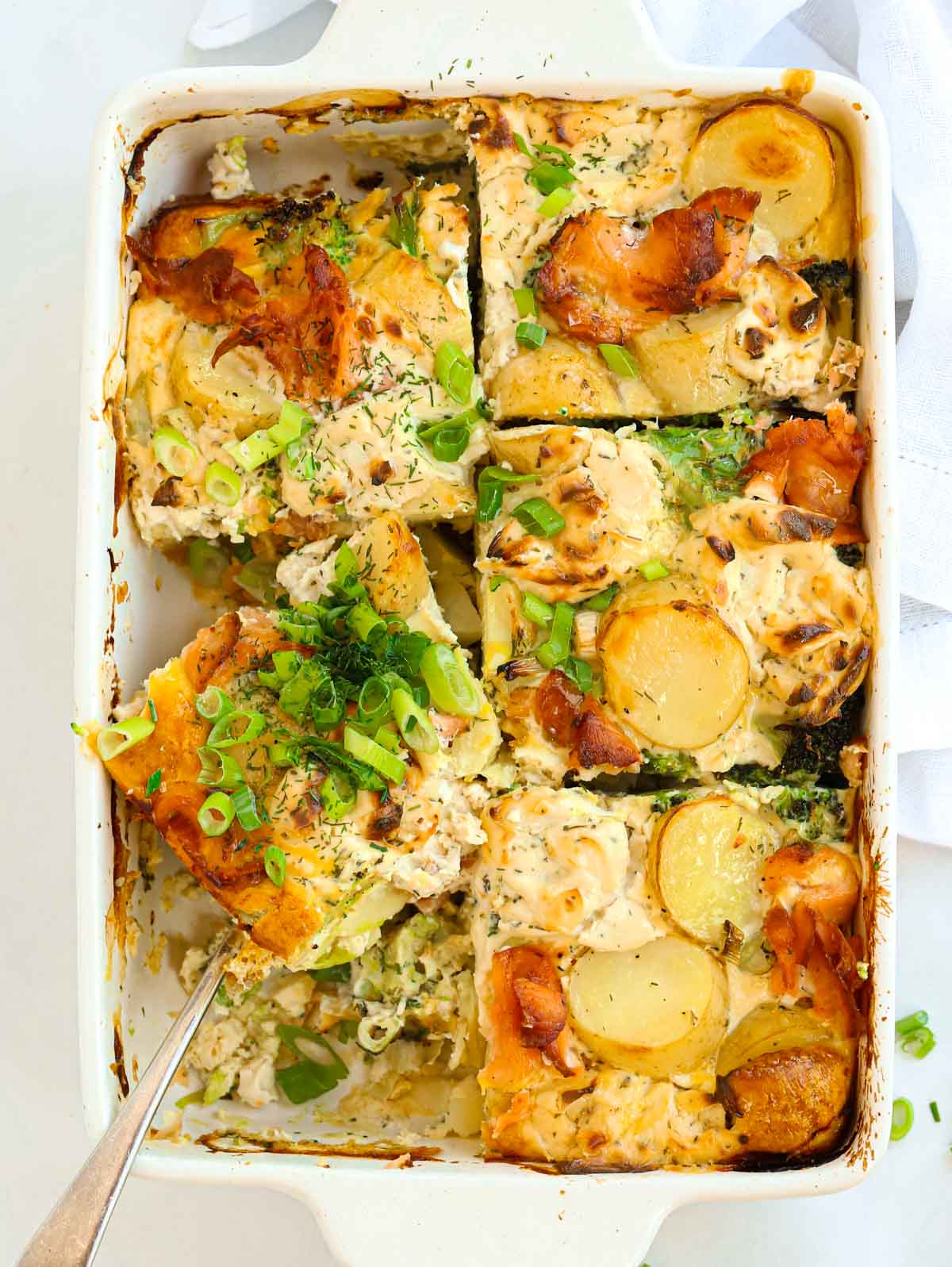 Sliced salmon bake with potatoes and broccoli