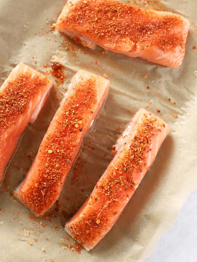 Salmon fish fillets with cajun seasoning ready to be baked for Salmon Tacos Recipe.