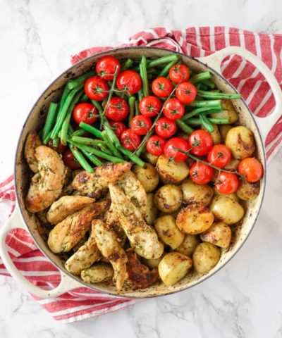 This pesto chicken bake is an easy, one pan, oven baked, family dinner. It's also dairy free and gluten free and packed with two portions of colourful vegetables.