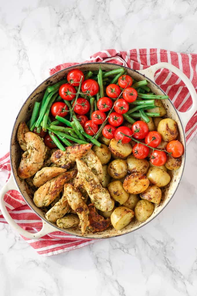 This pesto chicken bake is an easy, one pan, oven baked, family dinner. It's also dairy free and gluten free and packed with two portions of colourful vegetables. 