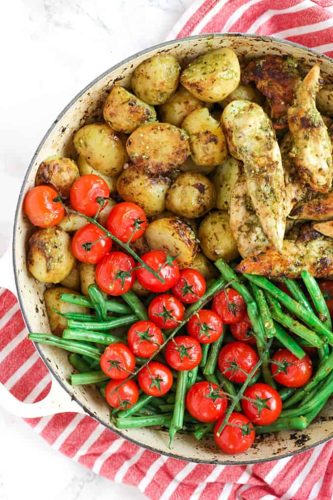 This pesto chicken bake is an easy, one pan, oven baked, family dinner. It's also dairy free and gluten free and packed with two portions of colourful vegetables.