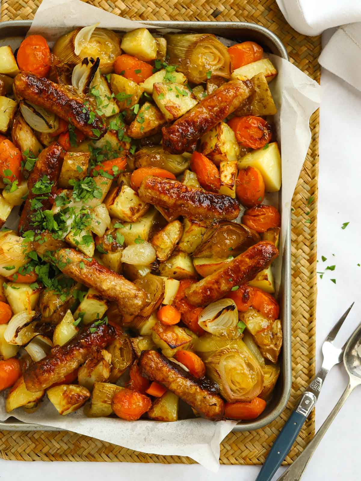 Sticky sausage tray bake recipe ready to serve.