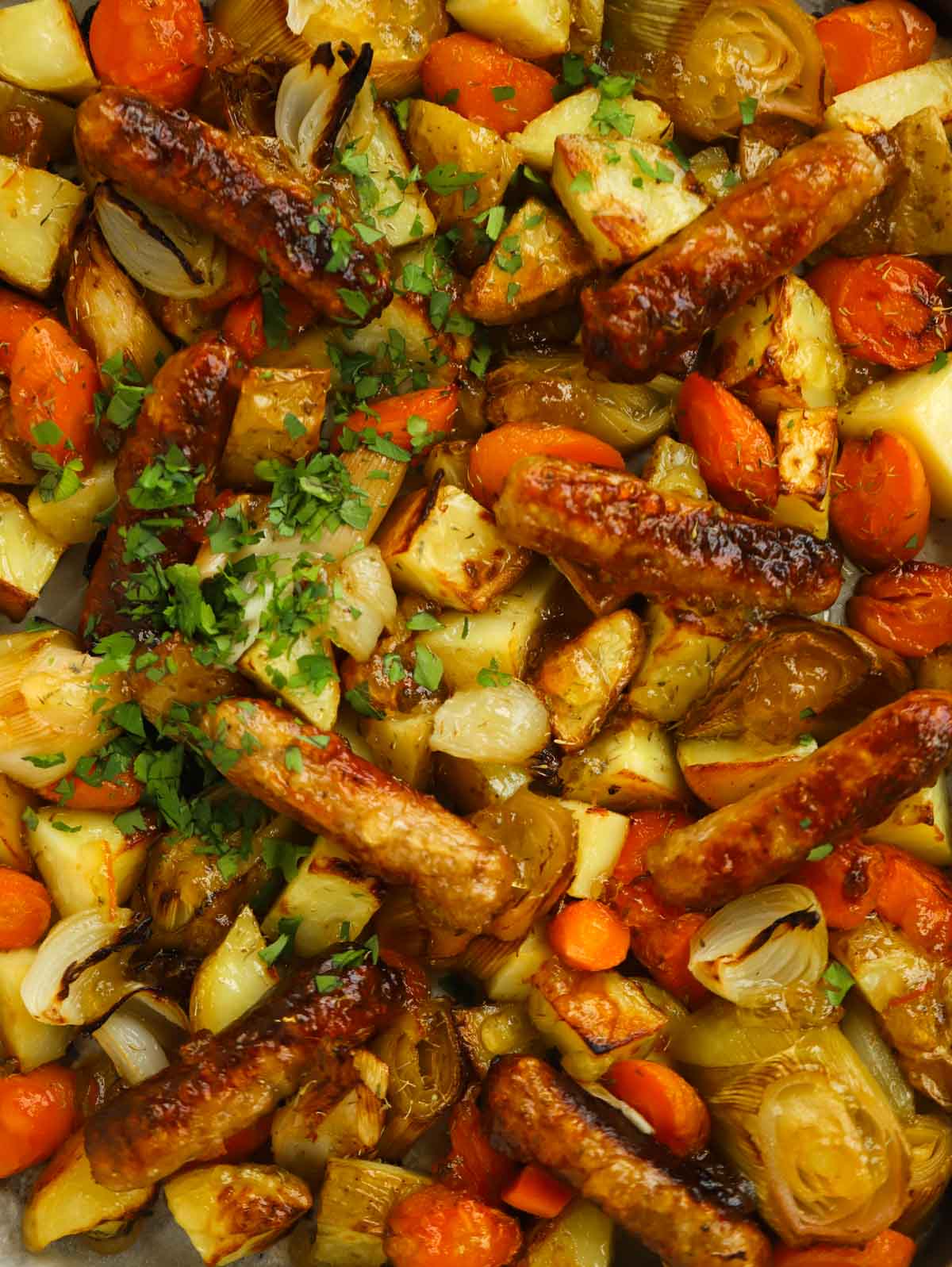 simple sausage tray bake with carrots potatoes and leeks