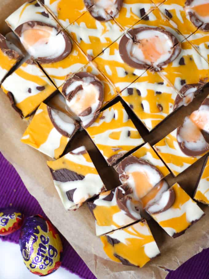 Close up overhead shot of Creme Egg Fudge drizzled with chocolate.