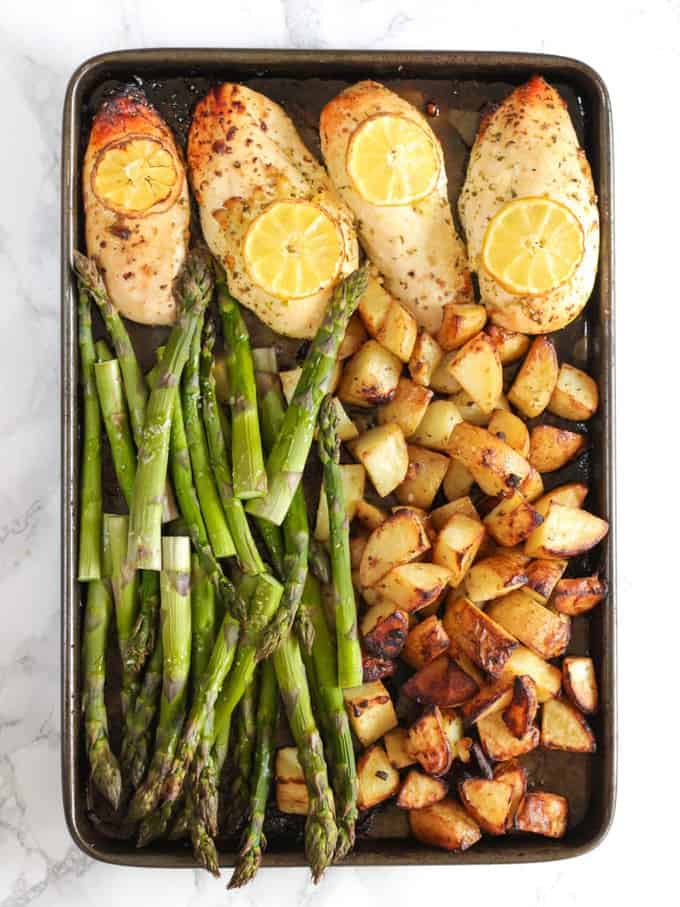 This One Pan Lemon Asparagus Chicken recipe is a quick and simple dinner using chicken breasts, roasted with potatoes, asparagus, lemon and honey. A really easy family meal.