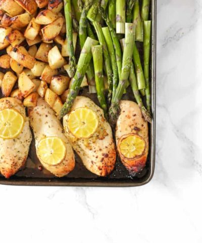 This One Pan Lemon Asparagus Chicken recipe is a quick and simple dinner using chicken breasts, roasted with potatoes, asparagus, lemon and honey. A really easy family meal.