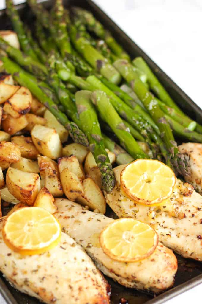 This One Pan Lemon Asparagus Chicken recipe is a quick and simple dinner using chicken breasts, roasted with potatoes, asparagus, lemon and honey. A really easy family meal.