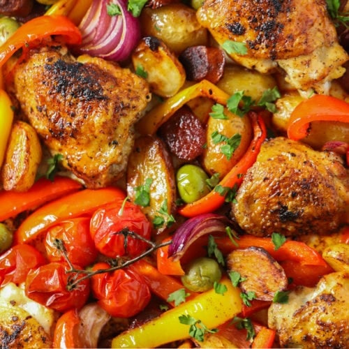 Easy spanish chicken and chorizo tray bake recipe sprinkled with parsley