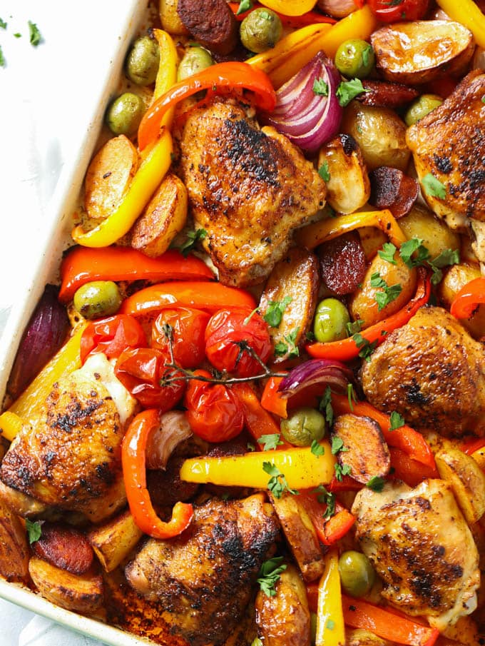Thighs roasted with peppers and tomatoes