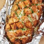 Cheesy Pesto Pull Apart Garlic Bread - A delicious cheese filled treat. The perfect side dish for dinner or snack. Pesto adds a delicious depth of flavour with the mozzarella cheese.