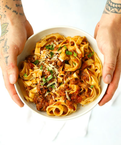 Beef bolognese recipe with pasta and parmesan and basil