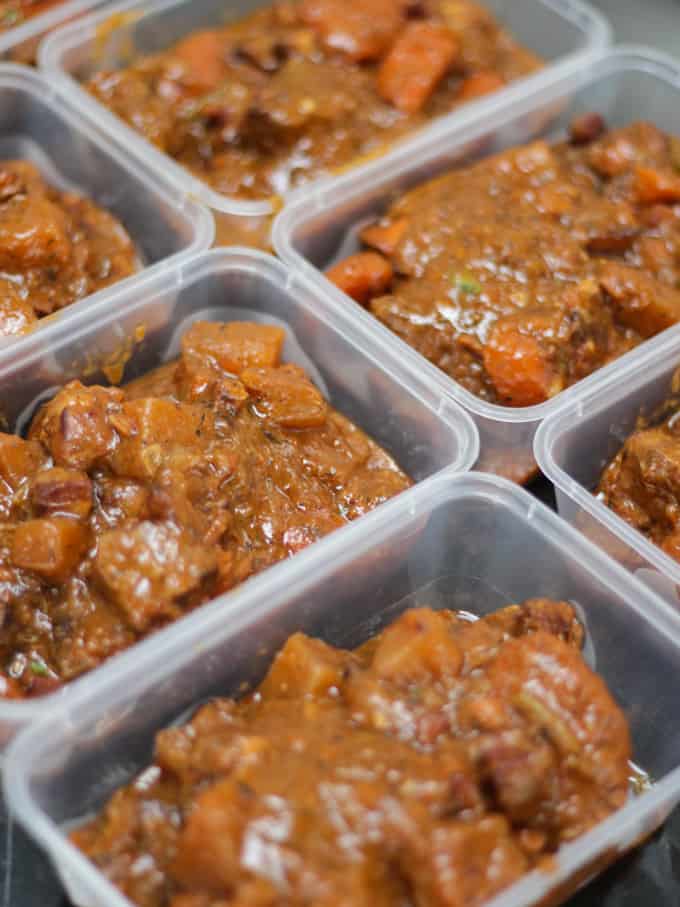 Takeaway containers full of stew ready for home freezing.