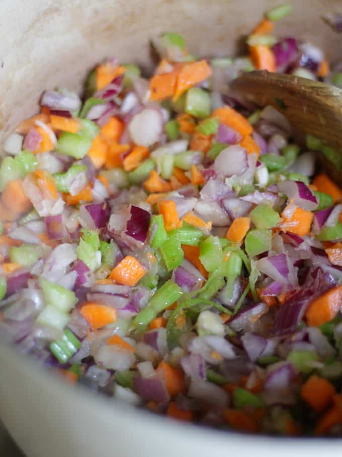 Celery, carrots and red onions chopped up into cubes and fried in a saucepan