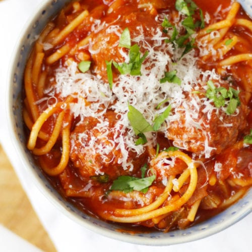 Easy meatballs recipe in a bowl with spaghetti.