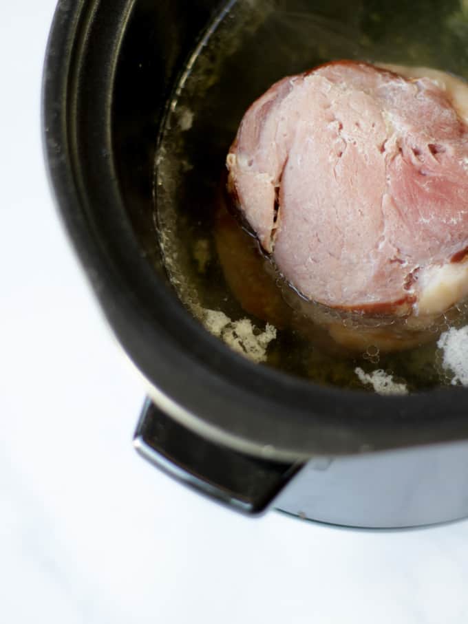 Gammon joint in water in slow cooker for pea and ham soup recipe.