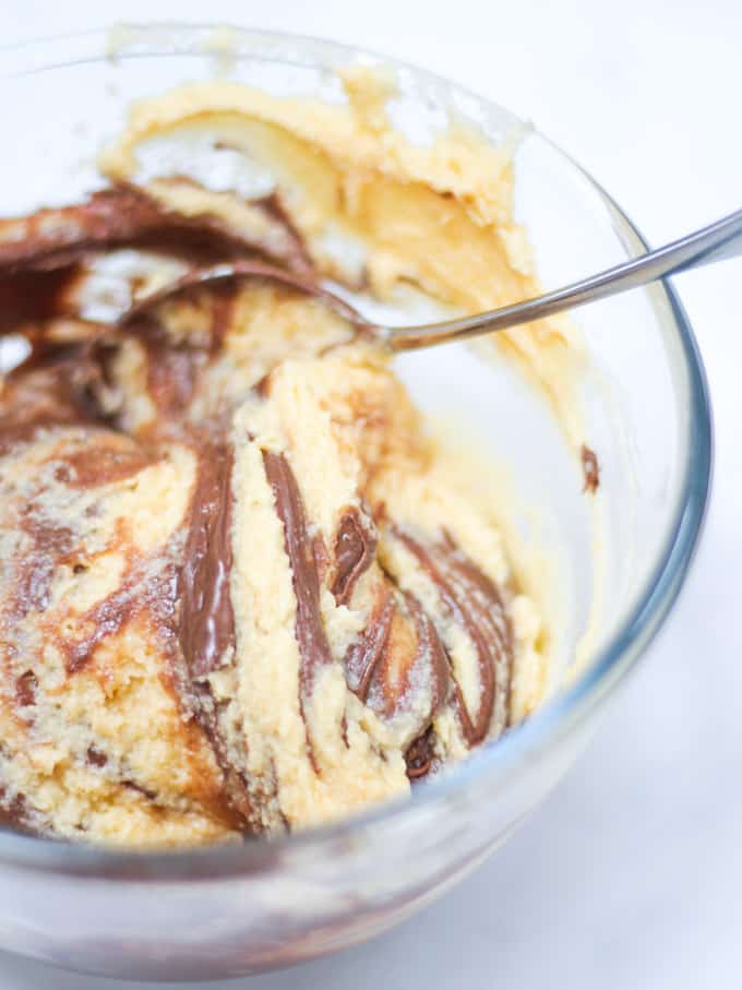 Marble cake mixture raw in glass bowl.