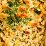 Close up of chicken and bacon pasta bake dish