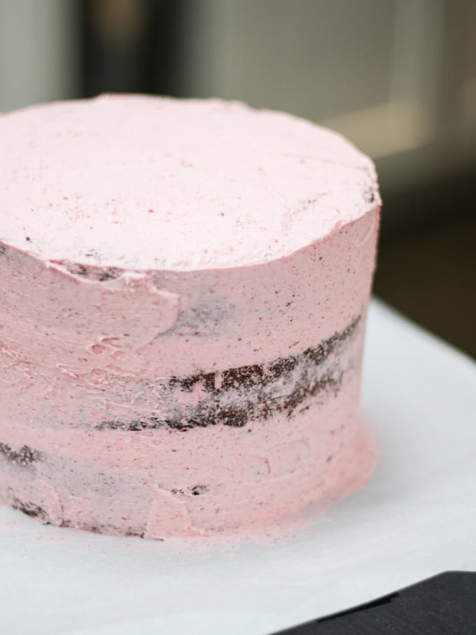 Raspberry cake crumb coated with icing.