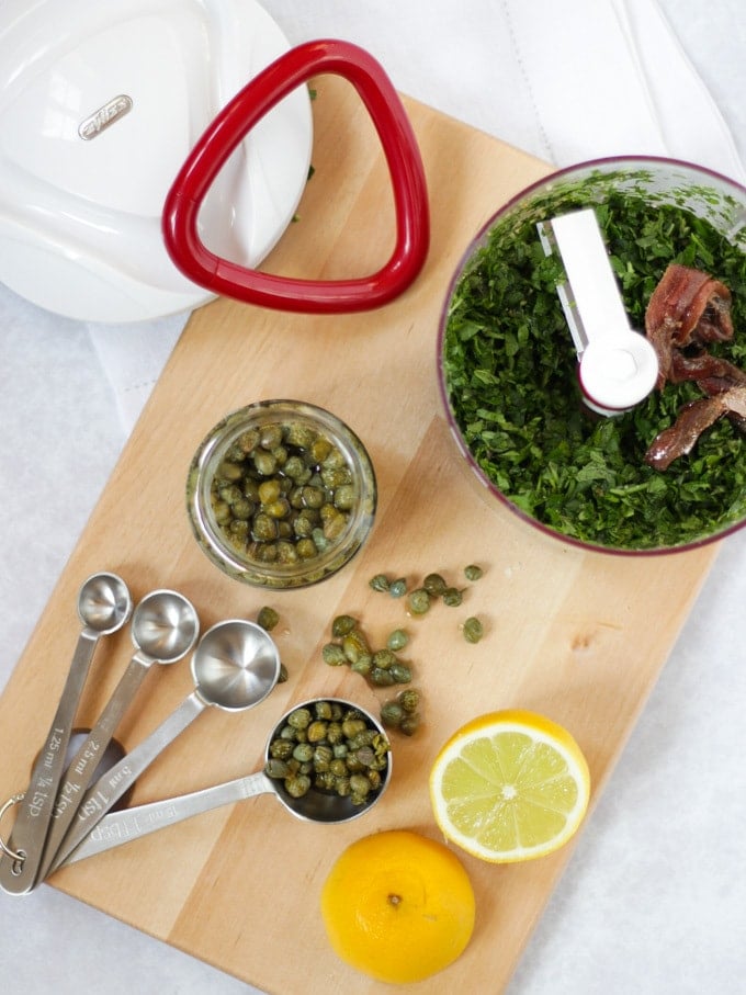 Mini chopped including ingredients for salsa verde for carrot salad.