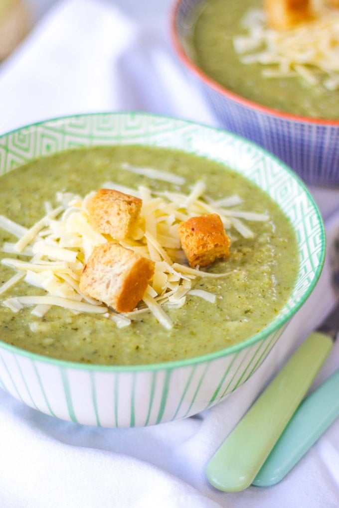 BROCCOLI AND CAULIFLOWER SOUP - This easy Broccoli and Cauliflower Soup recipe makes a family friendly lunch in minutes. Use frozen vegetables to keep things super simple. The child friendly version of Broccoli Stilton Soup, packs a punch with two portions of vegetables and plenty of taste. With a sprinkle of cheddar cheese and croutons for added taste and texture. This is also gluten free and vegetarian (if using vegetarian cheese and gluten free croutons) #tamingtwins #glutenfree #souprecipe