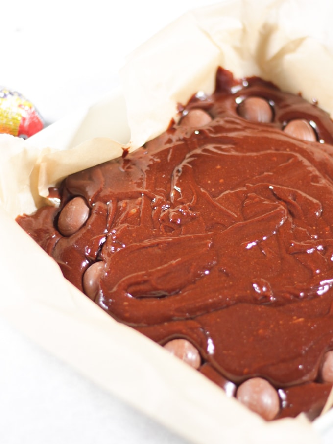 Dish of uncooked Creme Egg Brownies showing how to make