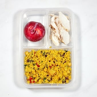 Healthy lunch idea, a cows cows chicken salad in a compartment lunchbox