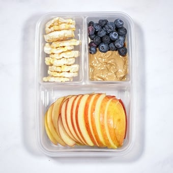 healthy lunch idea, apple, peanut butter and rice cakes